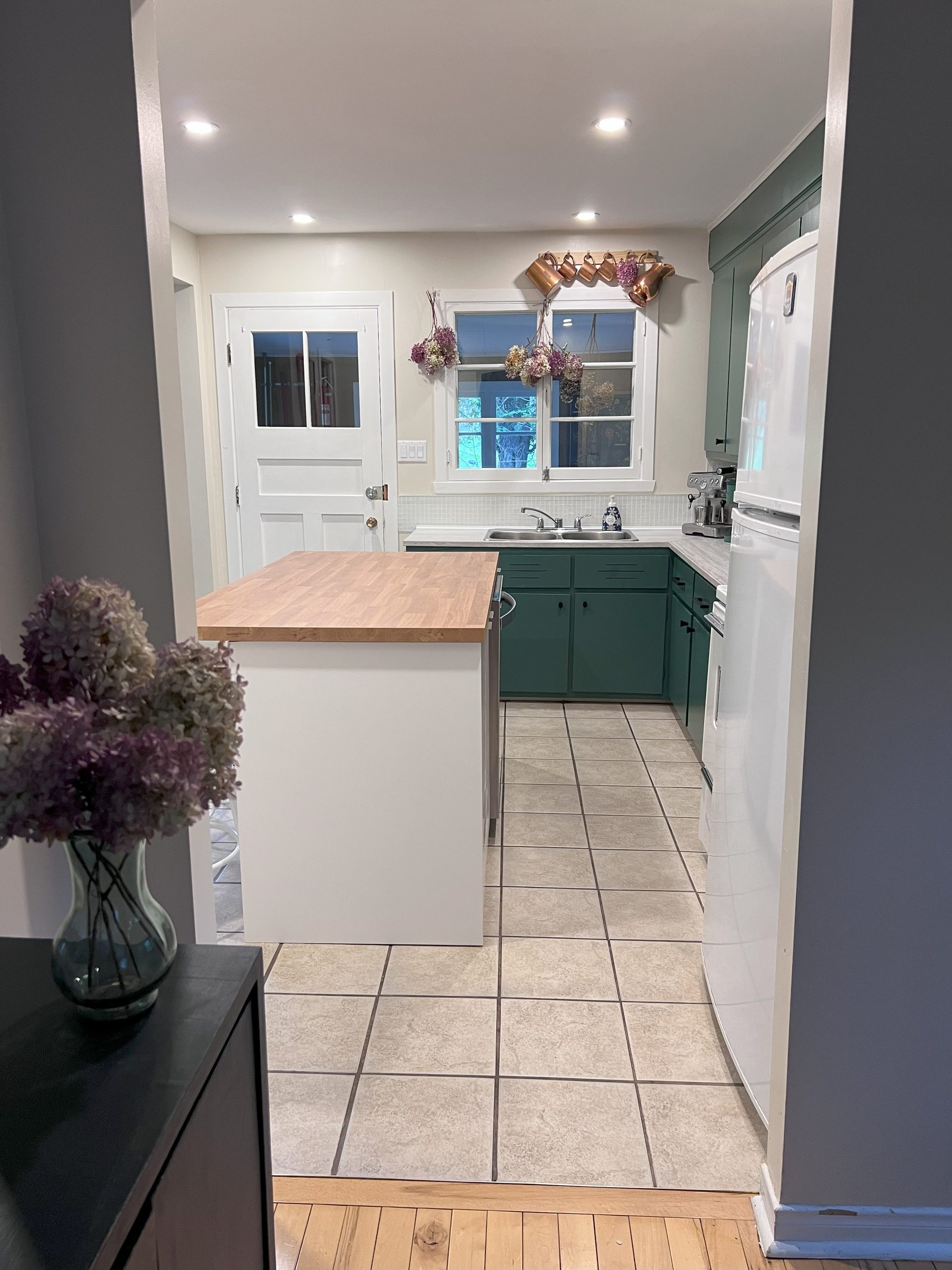 Kitchen with green cabinets
